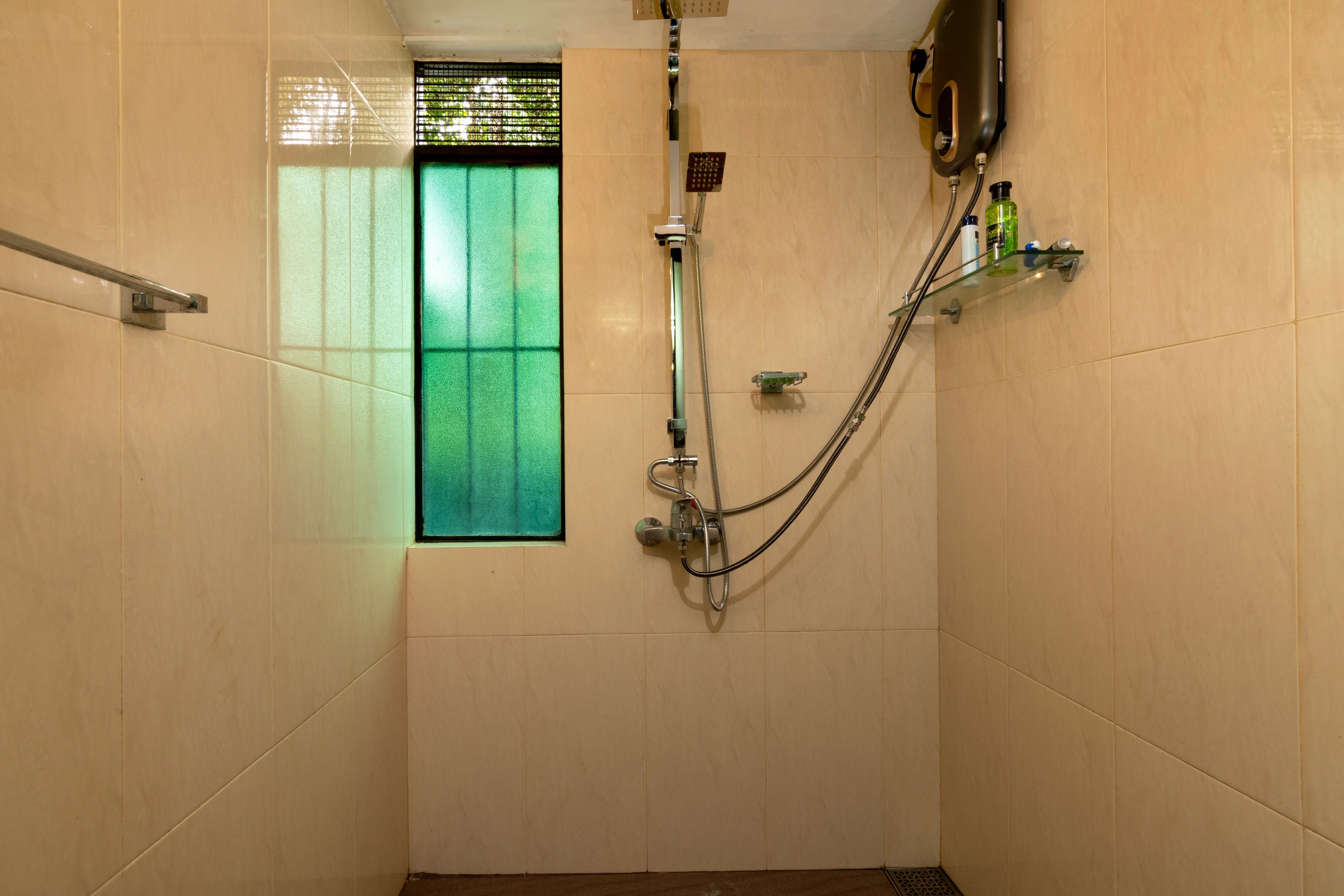 Shower room with beige walls