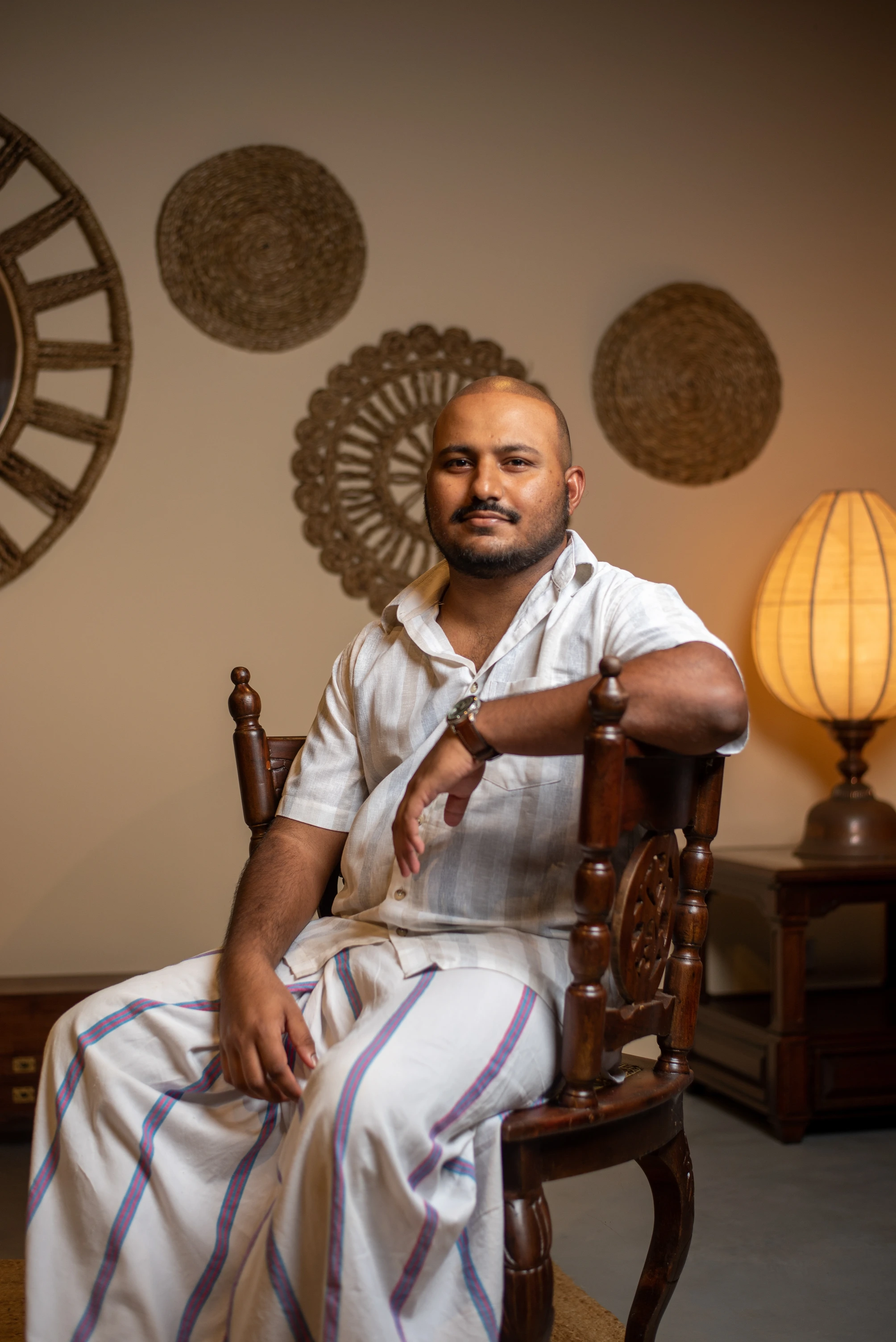 Portrait of villa owner AJ dressed in white traditional clothes